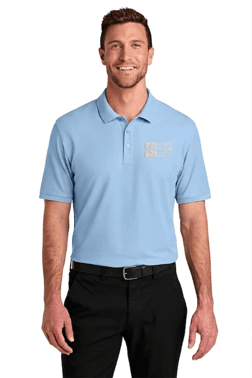 Man wearing a light blue polo shirt with a logo on a white background